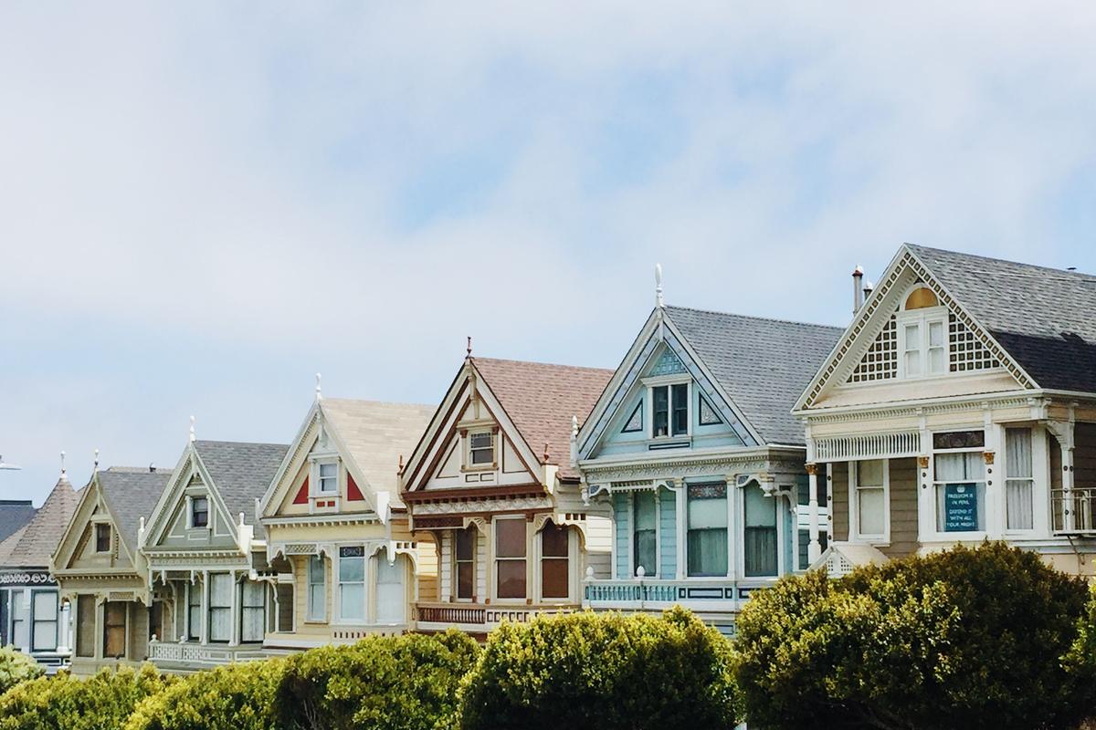 Row of painted Victorian houses