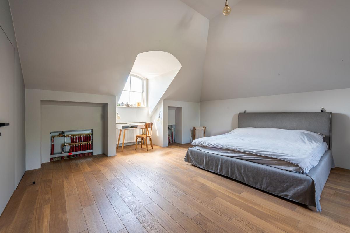 Bedroom with wide-plank wood floors
