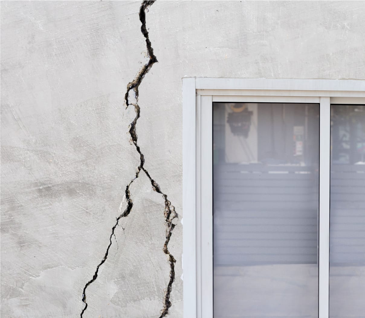 Earthquake damage to an exterior wall