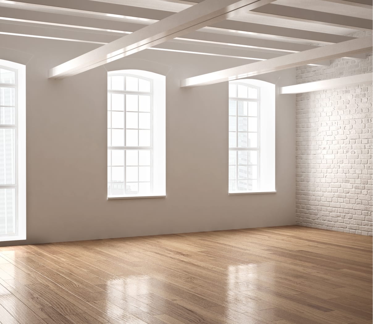 Clean, empty apartment with wood floors, white brick walls, and natural light coming in through the windows